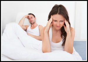 Unhappy Couple On Bed